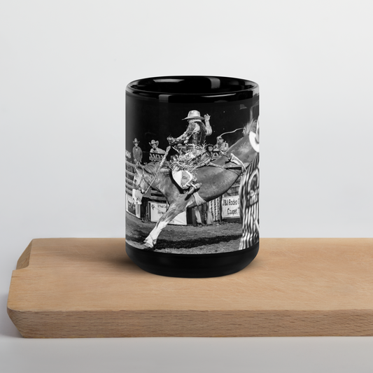 Black coffee cup with a saddle bronc rider at Cooper, Texas rodeo